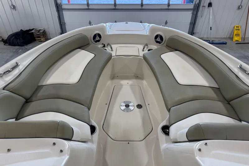 Slide: The Image of 2006 Sea Ray 240 Sundeck interior with spacious seating and sleek design. - 7