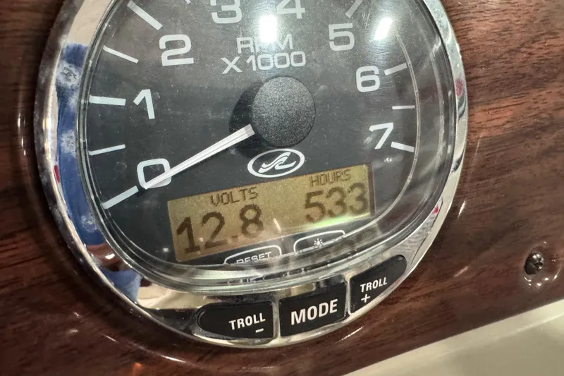 Slide: The Image of Close-up of 2005 Sea Ray 240 Sundeck tachometer showing 12.8 volts and 533 hours. - 14