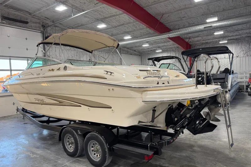 Slide: The Image of 1998 Sea Ray 280 Bow Rider boat on trailer in indoor storage facility. - 4