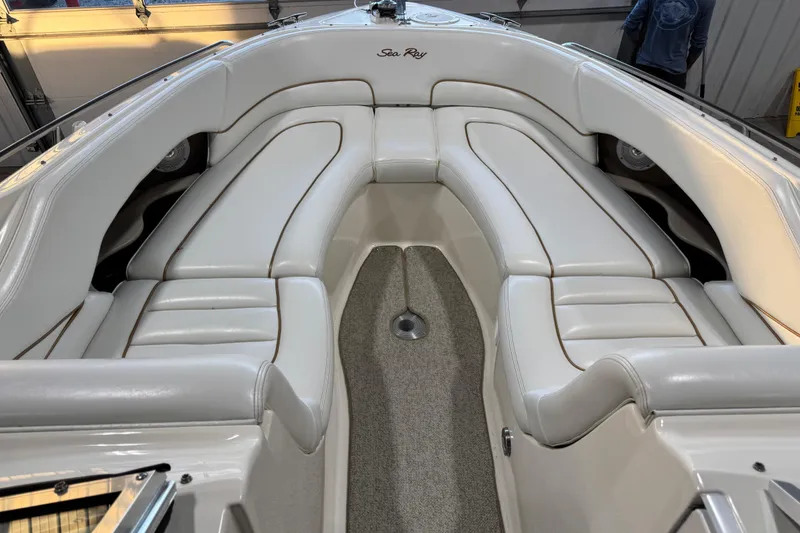Slide: The Image of 1998 Sea Ray 280 Bow Rider interior with white leather seating and carpeted floor. - 9