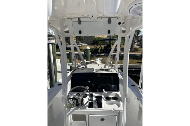 Slide: The Image of 2022 Sea Hunt BX 22 Pro boat console with steering wheel and controls. - 11