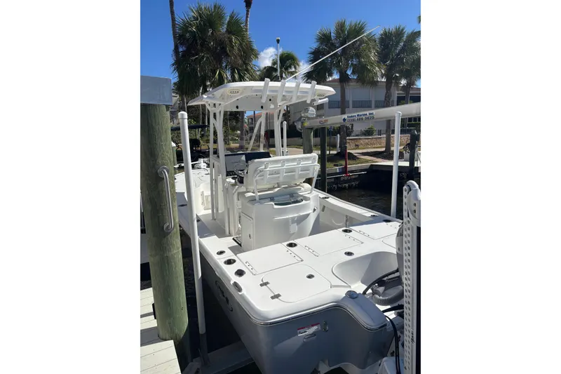 Slide: The Image of 2022 Sea Hunt BX 22 Pro boat docked, featuring sleek design and modern amenities. - 12