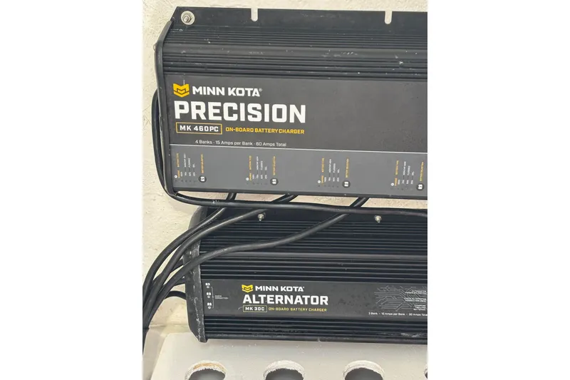 Slide: The Image of Minn Kota Precision and Alternator on-board battery chargers in a 2022 Sea Hunt BX 22 Pro boat. - 14