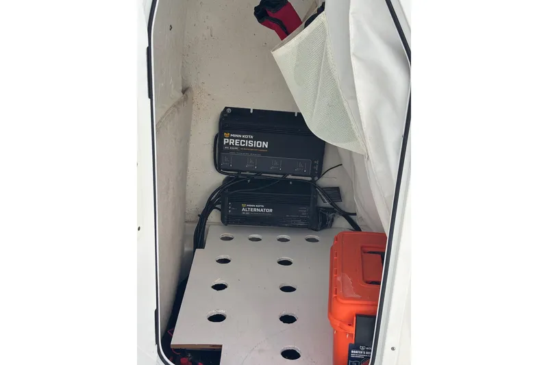 Slide: The Image of 2022 Sea Hunt BX 22 Pro boat storage with Minn Kota Precision charger and alternator. - 15