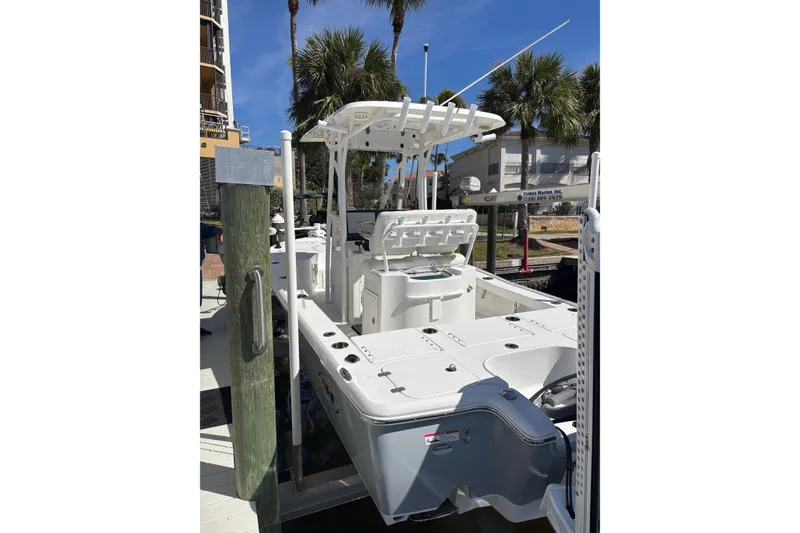 Slide: The Image of 2022 Sea Hunt BX 22 boat docked, featuring a sleek design and modern amenities. - 4