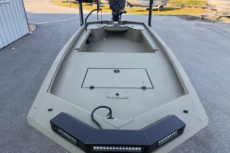 Slide: The Image of 2025 Diamondback 1860 Mudd Rattler boat, featuring a spacious deck and modern design. - 2