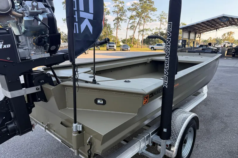 Slide: The Image of 2025 Diamondback 1860 Mudd Rattler boat on trailer, featuring powerful engine and sleek design. - 3