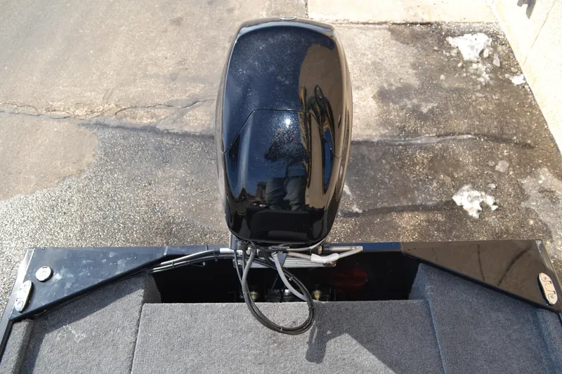 Slide: The Image of 2026 Tracker Bass Tracker Classic XL boat engine, top view on a concrete surface. - 31