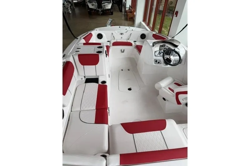 Slide: The Image of Interior of a 2026 Tahoe 1950 boat with red and white seating. - 5