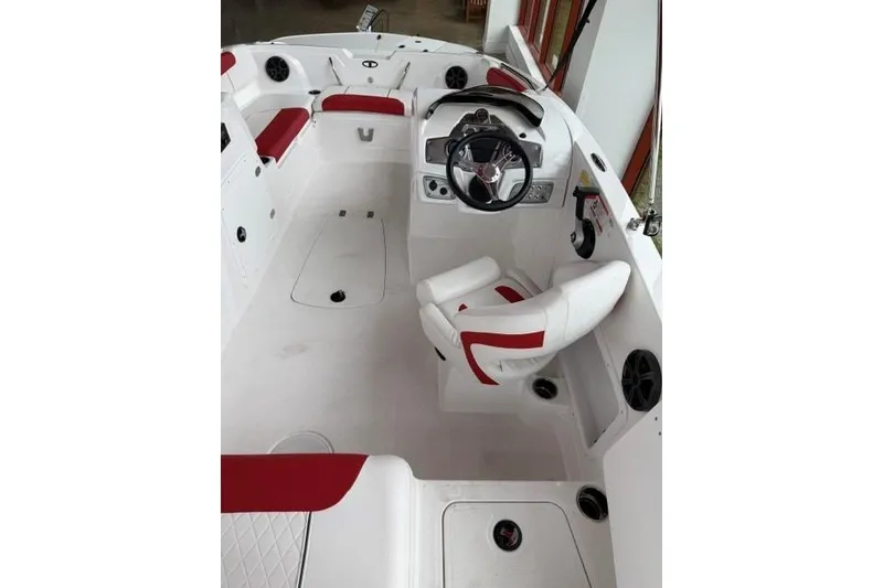 Slide: The Image of Interior of 2026 Tahoe 1950 boat with red and white seating and steering wheel. - 6
