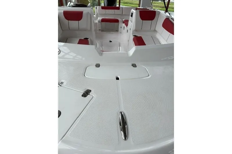 Slide: The Image of 2026 Tahoe 1950 boat interior with white and red seating, spacious deck layout. - 9