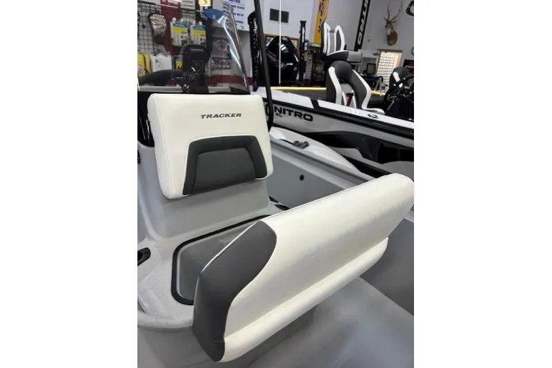 Slide: The Image of 2026 Tracker Bass Tracker Classic CC boat interior with white and gray seating. - 10