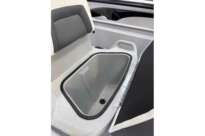 Slide: The Image of 2026 Tracker Bass Tracker Classic CC boat storage compartment with cushioned seating. - 11