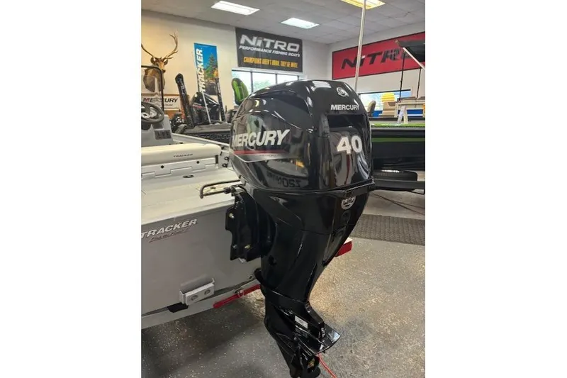 Slide: The Image of 2026 Tracker Bass Tracker Classic CC with Mercury 40 outboard motor in showroom. - 14