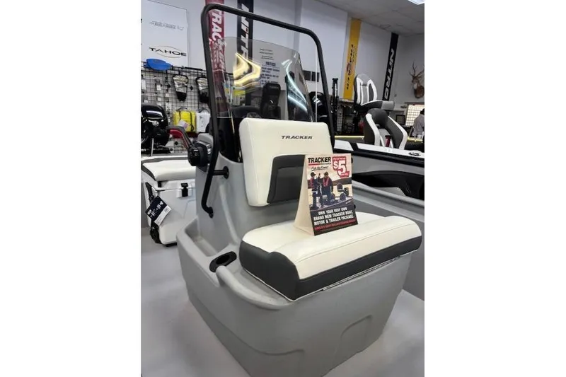 Slide: The Image of 2026 Tracker Bass Tracker Classic CC boat seat in showroom display. - 3
