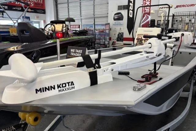 Slide: The Image of 2026 Tracker Bass Tracker Classic CC with Minn Kota Maxxum trolling motor in showroom. - 6
