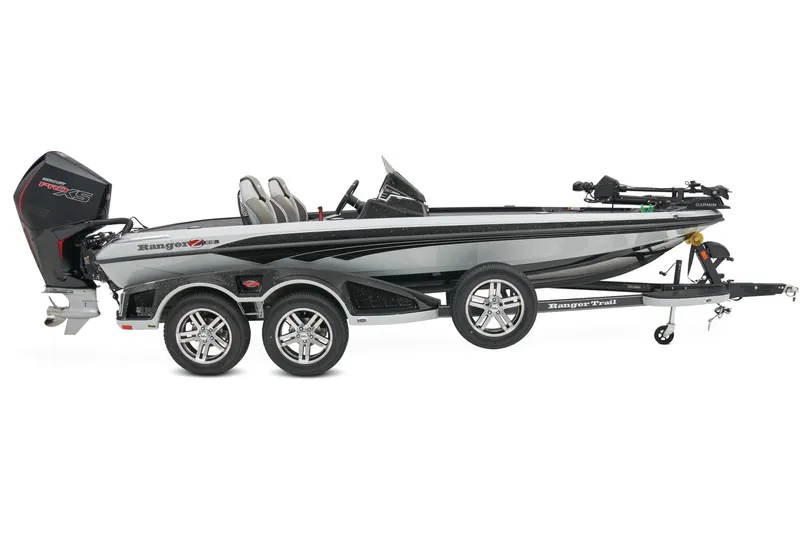 Slide: The Image of 2026 Ranger Z519R Cup-Equipped boat with red and gray seats, parked outdoors. - 7
