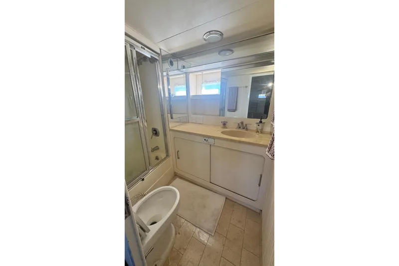 Slide: The Image of Bathroom interior of 1989 Hatteras 65 Motor Yacht with shower and vanity. - 12