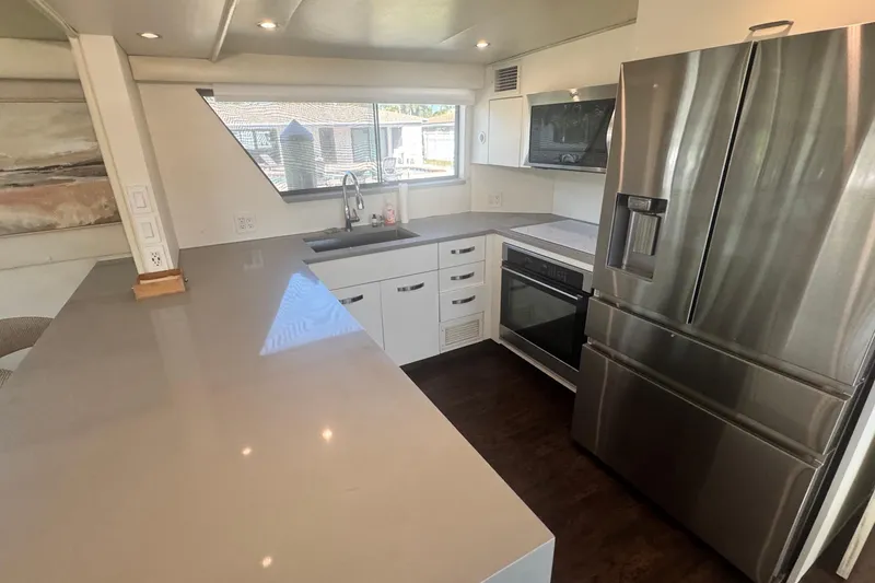 Slide: The Image of Modern kitchen interior on 1989 Hatteras 65 Motor Yacht with stainless steel appliances. - 5