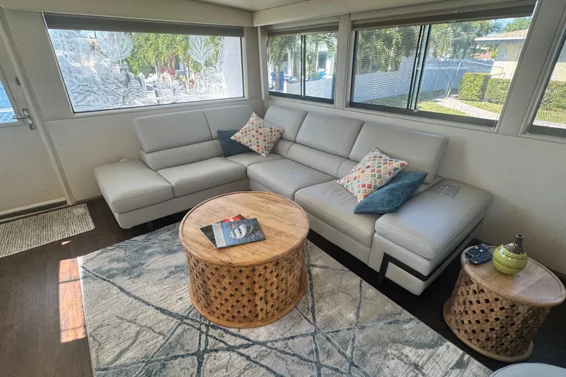 Slide: The Image of Luxurious interior of 1989 Hatteras 65 Motor Yacht with modern seating and decor. - 6