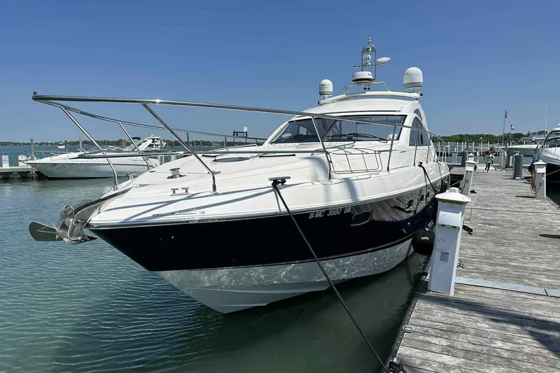Slide: The Image of 2007 Fairline Targa 47 GT yacht docked at marina under clear blue sky. - 0