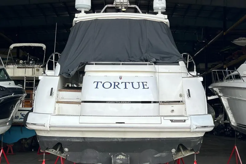 Slide: The Image of 2007 Fairline Targa 47 GT yacht in storage, rear view with cover. - 10