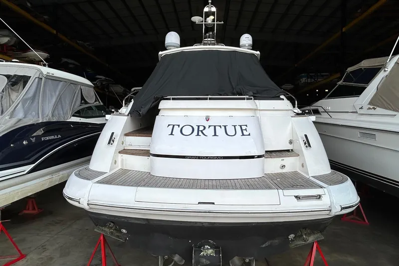 Slide: The Image of 2007 Fairline Targa 47 GT yacht in storage, rear view with cover. - 11