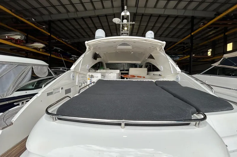 Slide: The Image of 2007 Fairline Targa 47 GT yacht in storage, showcasing sleek design and spacious deck. - 12