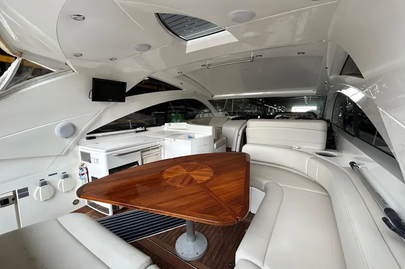 Slide: The Image of Luxurious interior of 2007 Fairline Targa 47 GT yacht with elegant seating and wooden table. - 18