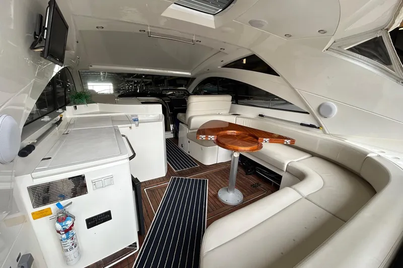 Slide: The Image of Luxurious interior of 2007 Fairline Targa 47 GT yacht with elegant seating and wooden table. - 19