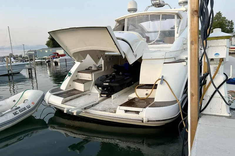 Slide: The Image of 2007 Fairline Targa 47 GT yacht docked with open rear storage. - 2