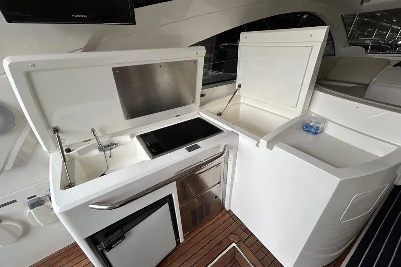 Slide: The Image of Luxury yacht galley on 2007 Fairline Targa 47 GT with sink, stove, and fridge. - 21