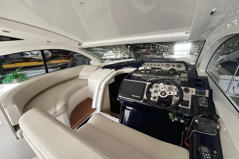 Slide: The Image of Interior of 2007 Fairline Targa 47 GT yacht with modern helm and seating area. - 24