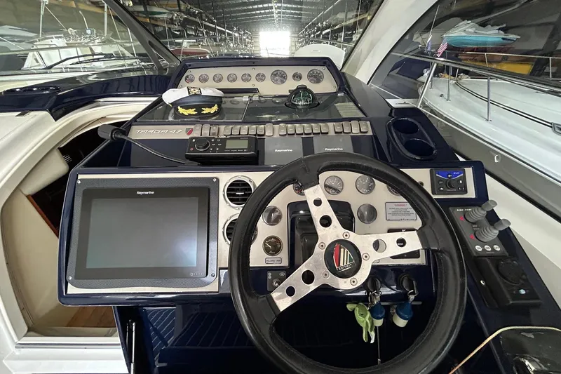 Slide: The Image of Cockpit of 2007 Fairline Targa 47 GT yacht with steering wheel and navigation controls. - 29