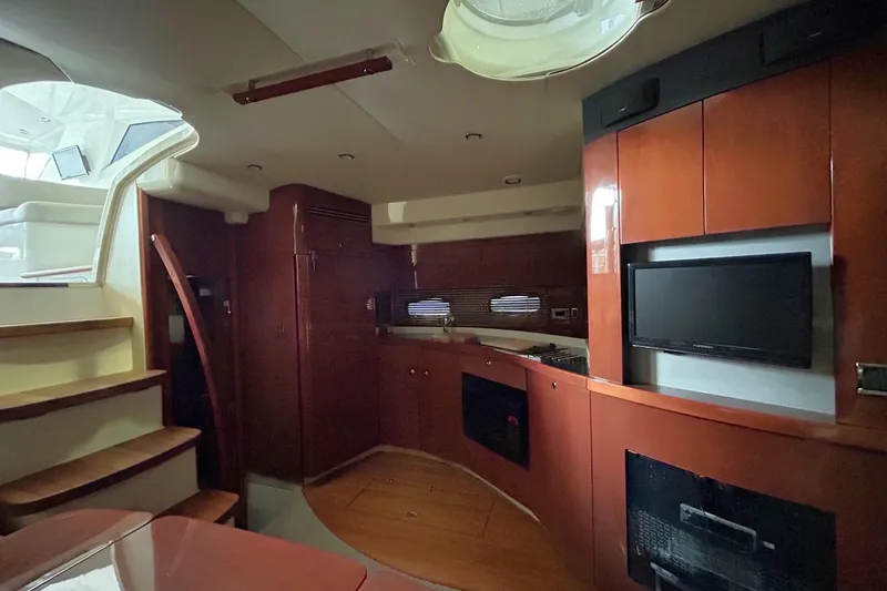 Slide: The Image of 2007 Fairline Targa 47 GT yacht interior with wood cabinetry and modern amenities. - 34