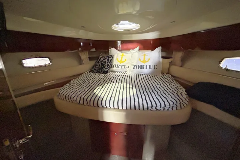 Slide: The Image of Luxurious cabin interior of 2007 Fairline Targa 47 GT yacht with striped bedding. - 36