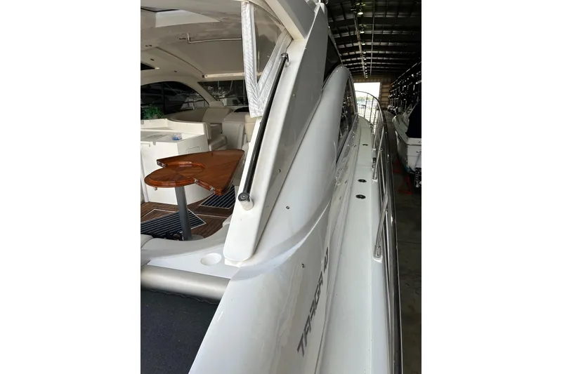 Slide: The Image of 2007 Fairline Targa 47 GT yacht interior with sleek design and wooden table. - 42