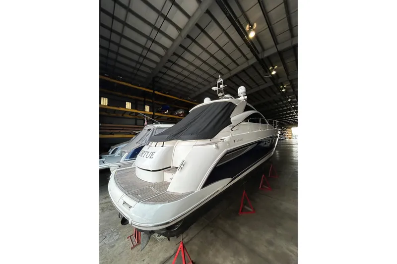 Slide: The Image of 2007 Fairline Targa 47 GT yacht in storage, covered and elevated on stands. - 43