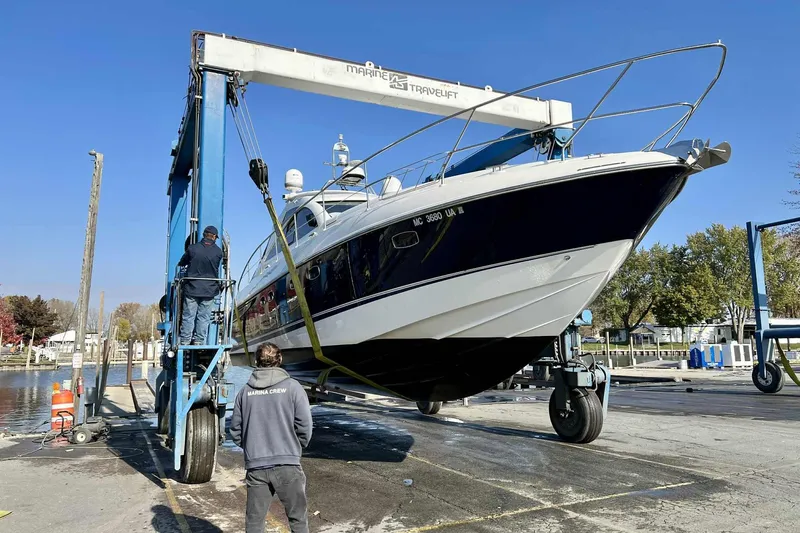 Slide: The Image of 2007 Fairline Targa 47 GT yacht being lifted at marina with crew assistance. - 8