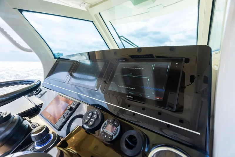 Slide: The Image of 2020 Scout 355 LXF boat dashboard with Garmin navigation system. - 24