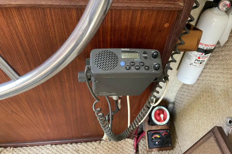 Slide: The Image of Interior of 1982 Mainship 34 MK 1 with radio, fire extinguisher, and steering wheel. - 18