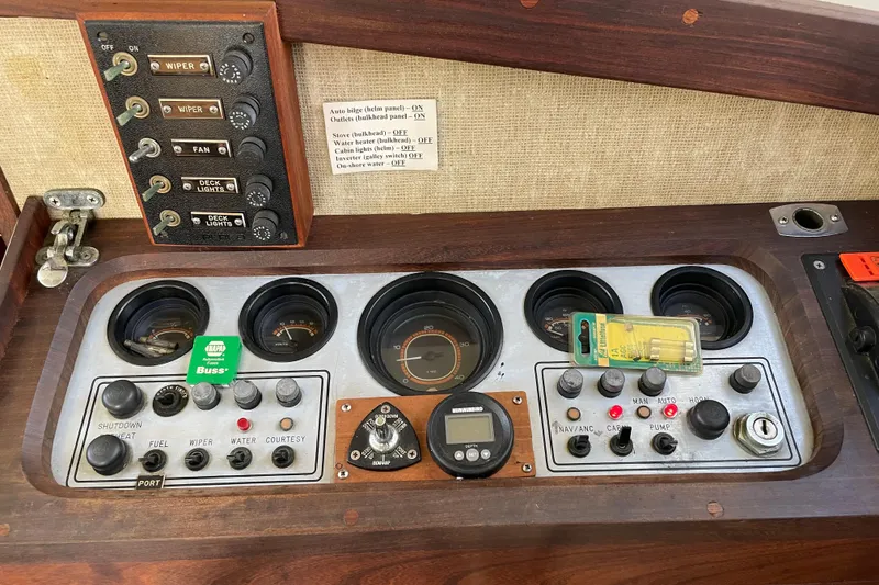Slide: The Image of Control panel of a 1982 Mainship 34 MK 1 boat with gauges and switches. - 19