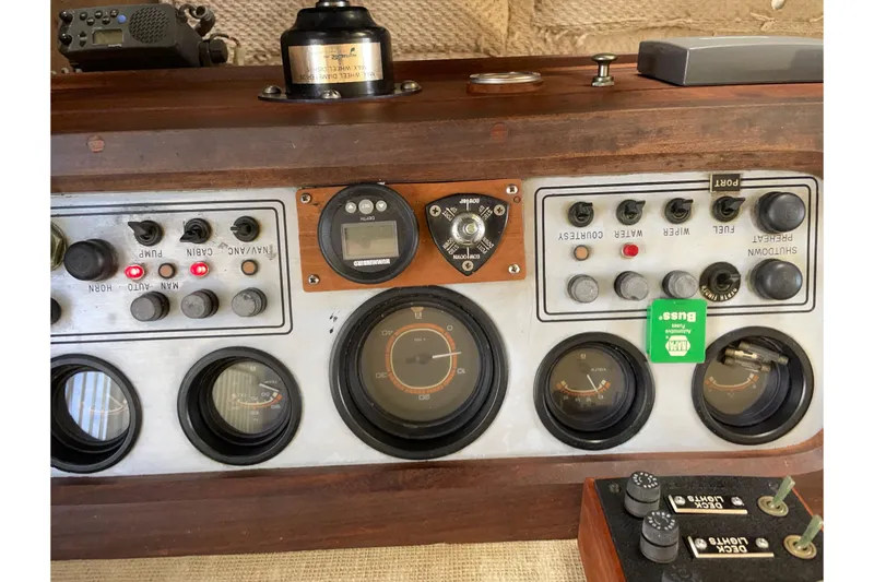 Slide: The Image of Control panel of a 1982 Mainship 34 MK 1 boat with gauges and switches. - 20