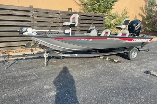 Slide: The Image of 2017 Tracker Pro Team 195 TXW fishing boat on trailer, parked outdoors. - 12