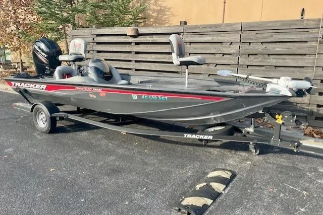 Slide: The Image of 2017 Tracker Pro Team 195 TXW fishing boat on trailer, parked outdoors. - 7