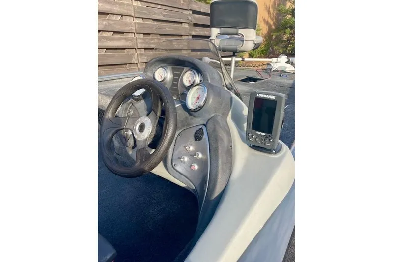 Slide: The Image of 2017 Tracker Pro Team 195 TXW boat dashboard with steering wheel and Lowrance fish finder. - 9