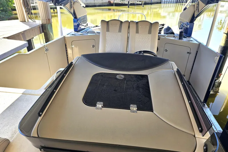 Slide: The Image of Luxurious seating area on 2018 Harris V270 boat with table and cup holders. - 22