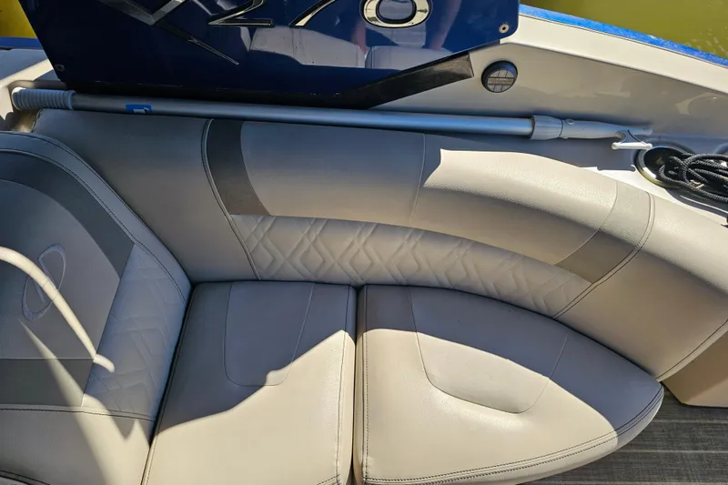 Slide: The Image of Luxurious seating on a 2018 Harris V270 boat, featuring elegant gray upholstery. - 30