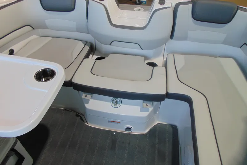 Slide: The Image of 2026 Yamaha AR190 boat interior with cushioned seating and table. - 10