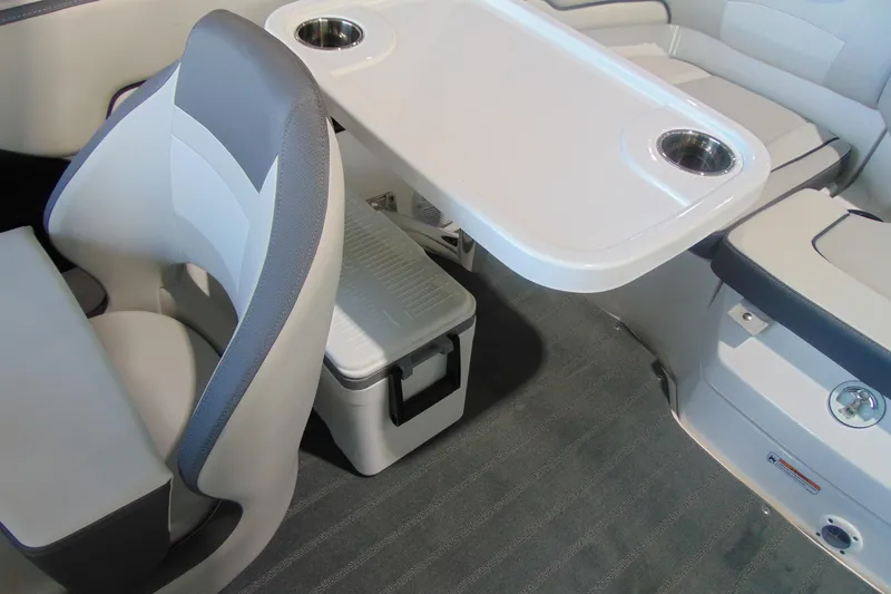 Slide: The Image of Interior of 2026 Yamaha AR190 boat with seating and table setup. - 12